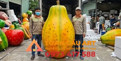 mo-hinh-xop-trai-du-du thi công mô hình xốp trái cây đu đủ tại xưởng